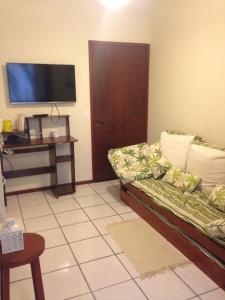 TV a/nebo společenská místnost v ubytování Condomínio Solar dos Reis