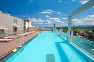 a swimming pool on the roof of a building at Chestertons Naksan in Yangyang +26 photos