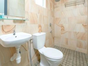 a bathroom with a toilet and a sink at HP Hope Hotel in Johor Bahru +22 photos