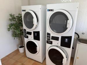 two washing machines are standing next to each other at Busselton Motel in Busselton