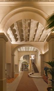 an archway with a staircase in a building at H10 Casa Mimosa 4* Sup in Barcelona