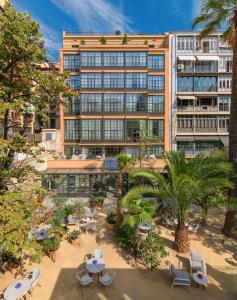 an overhead view of a building with tables and chairs at H10 Casa Mimosa 4* Sup in Barcelona
