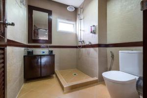 a bathroom with a toilet and a sink and a mirror at Cheeva Pool Villa Phuket in Phuket +99 photos