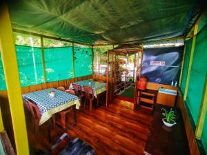 an inside view of a house with an aquarium at Munnar Plantation Villa in Munnar