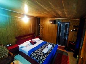 a bedroom with a bed with a tray on it at Munnar Plantation Villa in Munnar