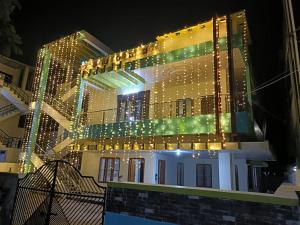 a building with christmas lights on top of it at Elixir Mansion in Pālakollu