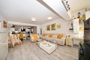 a living room with a couch and a table at AP Silvija in Zadar