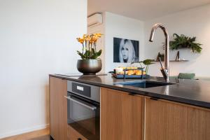 Η κουζίνα ή μικρή κουζίνα στο Kaai11 - Riverview Lofts & Suites