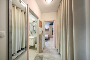 a bathroom with a sink and a mirror at AP Silvija in Zadar +192 photos