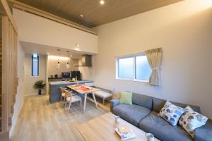 a living room with a couch and a table at TEMARI Premier NORTH in Hakone +51 photos