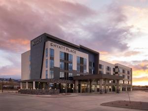 a large building with a sign on the side of it at Hyatt Place Casper in Casper
