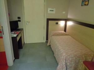 Postel nebo postele na pokoji v ubytování Hotel Airone