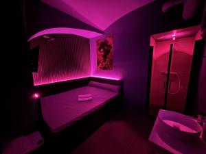 a bathroom with pink lights in a room at SPA SPA Petrská hostel in Prague