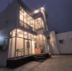 a large building with lights on the side of it at Sri Ram Shankar-Saryu Ghat in Ayodhya