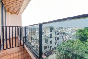 a balcony with a view of a city at FabHotel Blooming Beds Pearl in Jaipur +33 photos