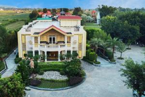 an aerial view of a house with a garden at Resort De Coracao - Corbett , Uttarakhand in Rāmnagar