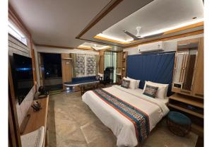 a bedroom with a large bed in a room at The VP Residency Towerrs in Tiruttani