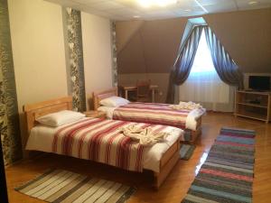 Postel nebo postele na pokoji v ubytování Hotel Svitlytsia