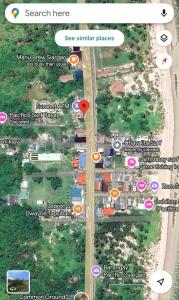 a map of a street with buildings and buildings at Ayu Homestay in San Isidro