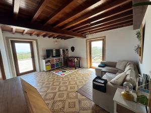 a living room with a couch and a table at A Vixía do Roncudo in Corme-Puerto