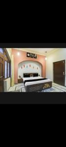 a bedroom with a large bed in a room at Hotel Pink Haveli in Jaipur +18 photos