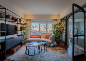a living room with a couch and a table at Hovagimyan Hotel and Suites in Istanbul
