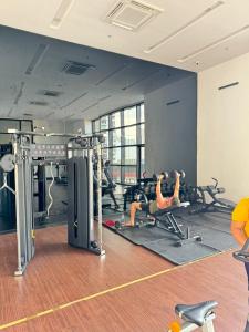 a gym with two people doing pushups in machines at Chamber Haven KL in Kuala Lumpur