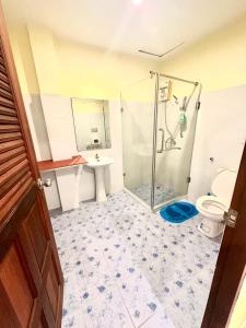 a bathroom with a shower and a toilet and a sink at Tnon Samui Hostel in Chaweng +37 photos