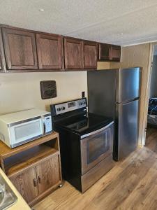 a kitchen with a stove and a refrigerator at Mem's Place in Bluefield