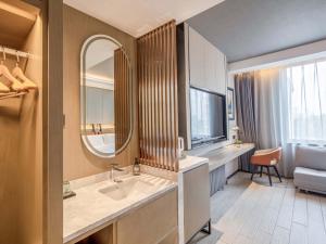 a bathroom with a sink and a mirror at Yilan Yunjing Boutique Hotel in Beijing +42 photos