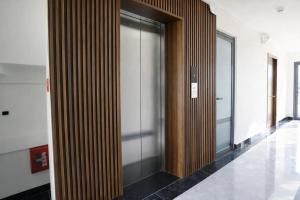 a hallway with a glass door in a building at Hoa Dã Quỳ Hotel in Pleiku