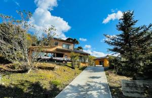 a house on a hill with a pathway at SEN RETREAT TAKAHARA - Kumano Kodo Gateway in Chikatsuyu