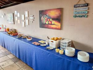 a blue table with food on top of it at Pecém Hotel in Pecém +31 photos