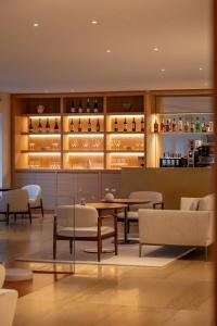 a dining room with a table and chairs at Lasala Plaza Hotel - Adults Only in San Sebastián