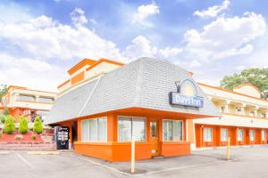 a building with a sign on the front of it at Days Inn by Wyndham Tannersville in Tannersville