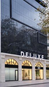 a building with a sign on the side of it at Myway Deluxe Hotel in Konak