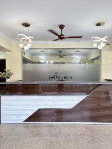 a lobby of a furniture store with a ceiling fan at Hotel Fortune Home Residency Near Spectrum Mall Sector 72 in Noida