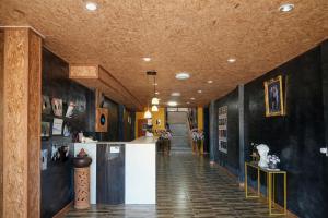 a hallway of a building with a counter in it at B&T Hostel in Ban Pa Tung (7)