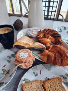 a plate of bread and pastries on a table at Encanto en el Moncayo in San Martín de Moncayo