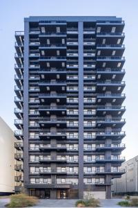 a large apartment building with balconies at The OneFive Osaka Shinsekai in Osaka