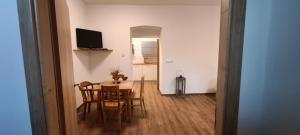 a kitchen and dining room with a table and chairs at Hvězda in Želnava