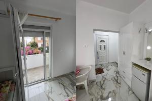 a bathroom with a sink and a toilet in a room at NEAR Guest-house in Durrës