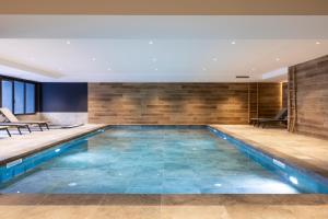 a swimming pool in a house with a poolvisorvisor at TERRESENS - Les Sources de Canopée in Saint-Gervais-les-Bains