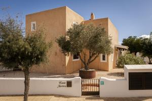 a building with two trees in front of it at CAN NOVES - Villa de 5 suites 58 y 15 in Sant Francesc Xavier