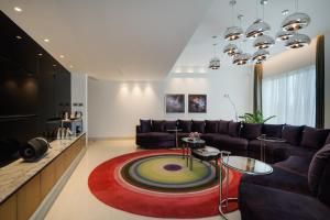 a living room with a couch and a table at Avasa Hotel in Hyderabad