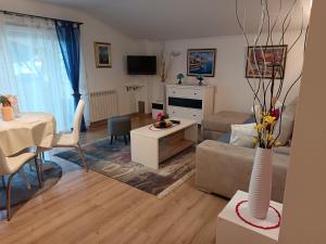 a living room with a couch and a table at Appartmani Punta in Umag