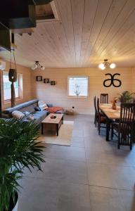 a living room with a couch and a table at Domek w Zabrzeży in Łącko