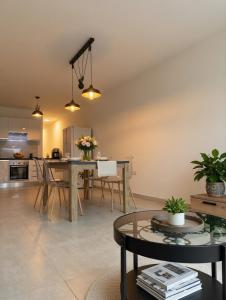 a kitchen and living room with a table and chairs at Marina District in Pieta