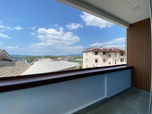 a balcony with a view of a building at Baan Ban Dalay in Ao Nang Beach