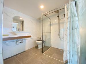 a bathroom with a shower and a toilet and a sink at Baan Ban Dalay in Ao Nang Beach +111 photos